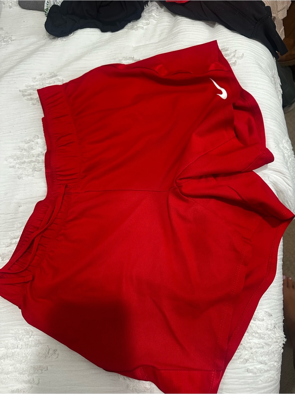 Nike Women’s Red Athletic Shorts with White Swoosh